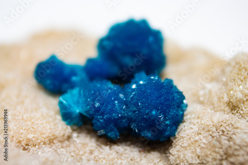 Natural cluster blue cavansite on the substrate macro photo