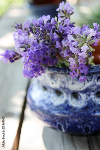 Fototapeta Naklejka Na Ścianę i Meble -  A bouquet of fresh cut lavender with tableware Gzhel