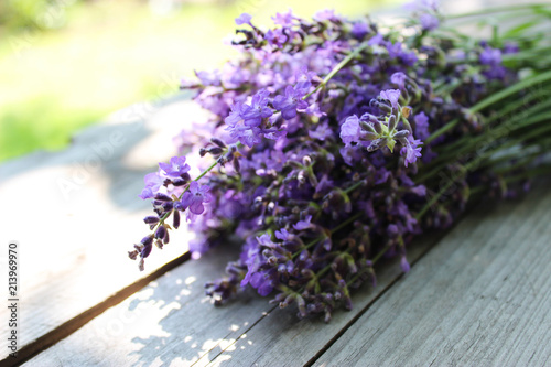 Fototapeta Naklejka Na Ścianę i Meble -  A bouquet of fresh cut lavender with tableware Gzhel