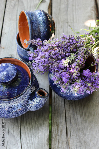 Fototapeta Naklejka Na Ścianę i Meble -  A bouquet of fresh cut lavender with tableware Gzhel