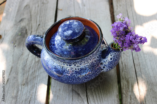 Fototapeta Naklejka Na Ścianę i Meble -  A bouquet of fresh cut lavender with tableware Gzhel
