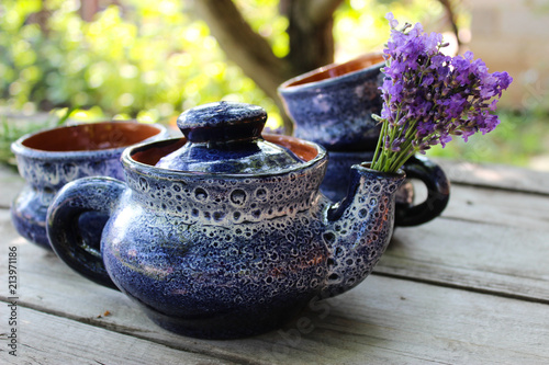 Fototapeta Naklejka Na Ścianę i Meble -  A bouquet of fresh cut lavender with tableware Gzhel