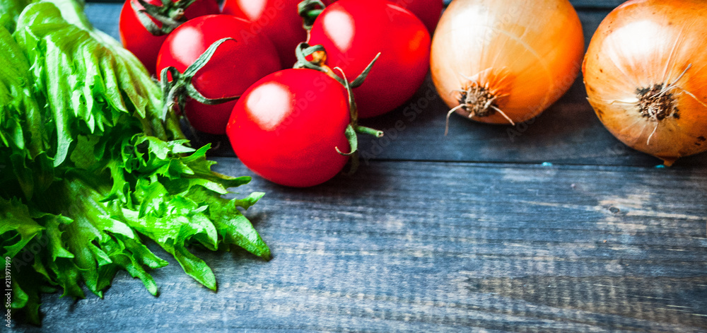 Raw veggies on a wooden surface in rustic style, vegetables background