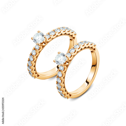 A pair of luxury yellow gold rings with diamonds on the white background, A pair of golden rings isolated