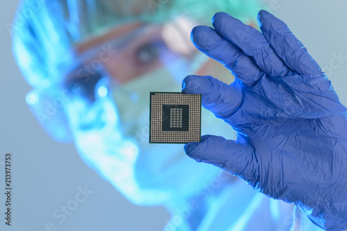 Photography The engineer holds a processor in hands
