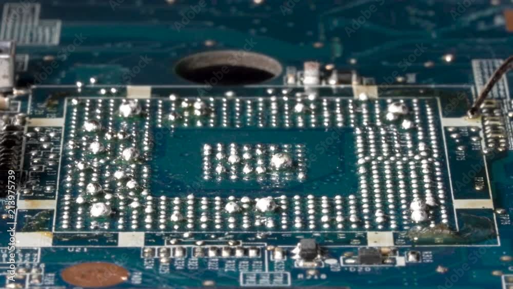 Hot bga balls soldering on the pcb heated by bga rework station. Closeup macro. StockVideo