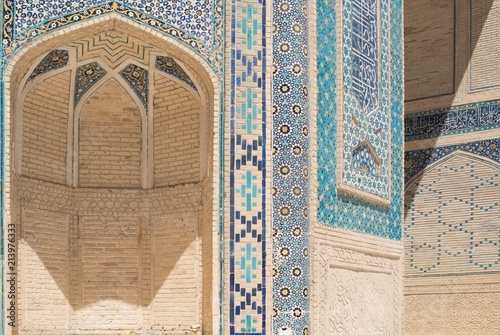 High arch with traditional Eastern ornaments. Ancient buildings of medieval Asia. Bukhara, Uzbekistan