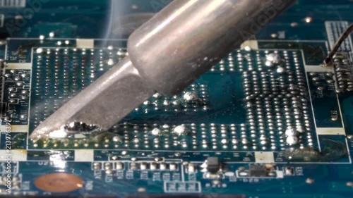Removing bga balls from the pcb. bga rework station. Closeup macro.