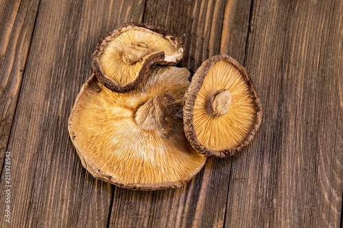 Dried shitake mushrooms on wooden tabletop