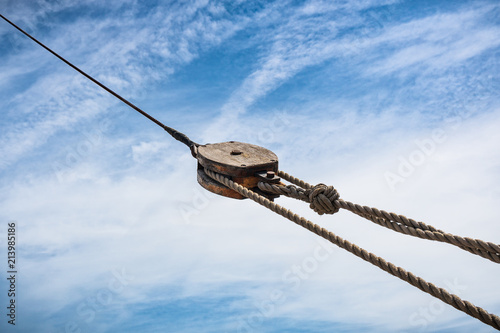 Wooden pulley on  old yacht.