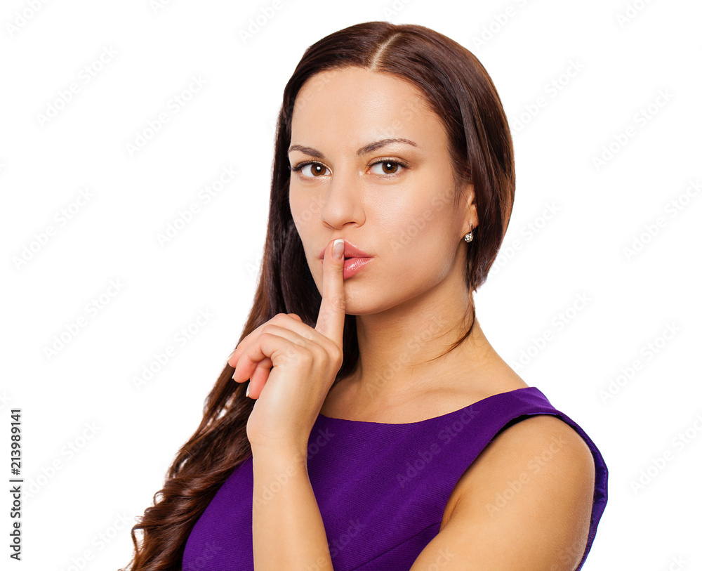Young beautiful woman has put forefinger to lips as sign of silence Young beautiful woman has put forefinger to lips as sign of silence