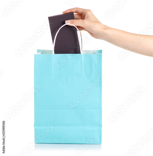 Black box in hand paper bag package on white background isolation