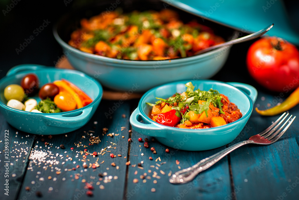 Stewed vegetables on the table. chopped greens. produce