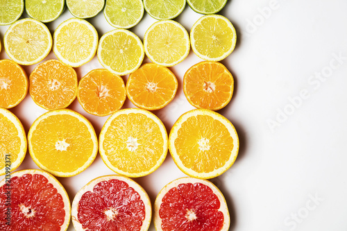 Citrus fruit background. Slices of grapefruit  orange  lemon and lime