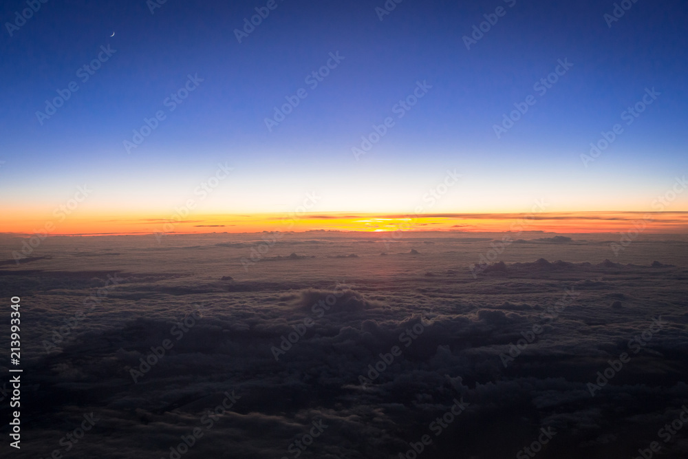 Aerial scenery of sunset over the clouds