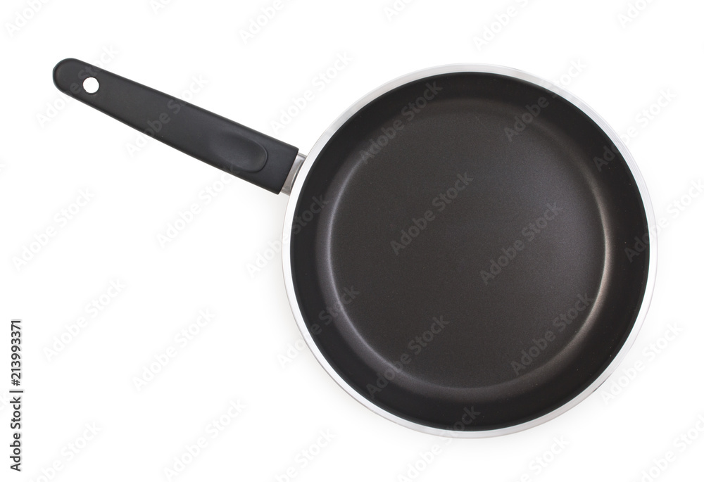 Black frying pan with nonstick surface isolated on white background, close-up, top view. Black frying pan with nonstick surface isolated on white background, close-up, top view.