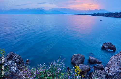 Seascape timelapse of high mountains over clear sunset sky in Antalya, Turkey. © Ryzhkov Oleksandr