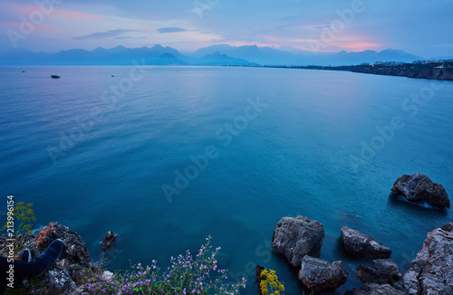 Seascape timelapse of high mountains over clear sunset sky in Antalya, Turkey. © Ryzhkov Oleksandr