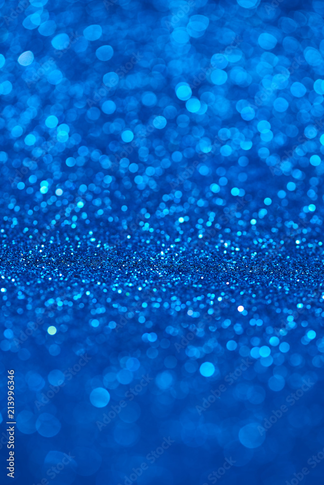 Blue bokeh background of glitter lights