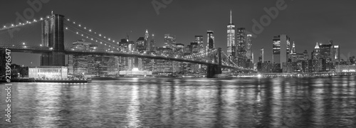 Black and white picture of New York City skyline at night, USA.