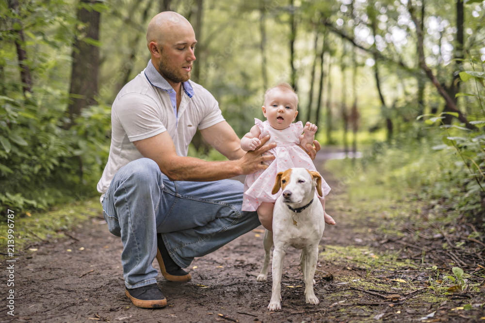 Father and daughter baby in summer meadow park Father and daughter baby in summer meadow park