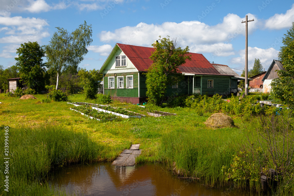 Old wooden house in rural vegetable garden Old wooden house in rural vegetable garden