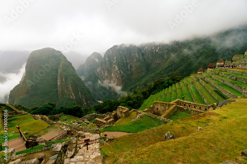 Agricultural terraces of Machu Picchu with mountain Putucusi in the background photo