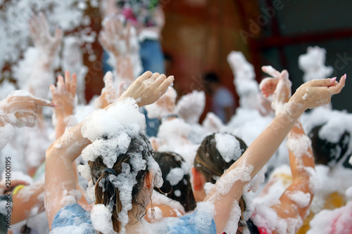 People dancing at the foam party photo