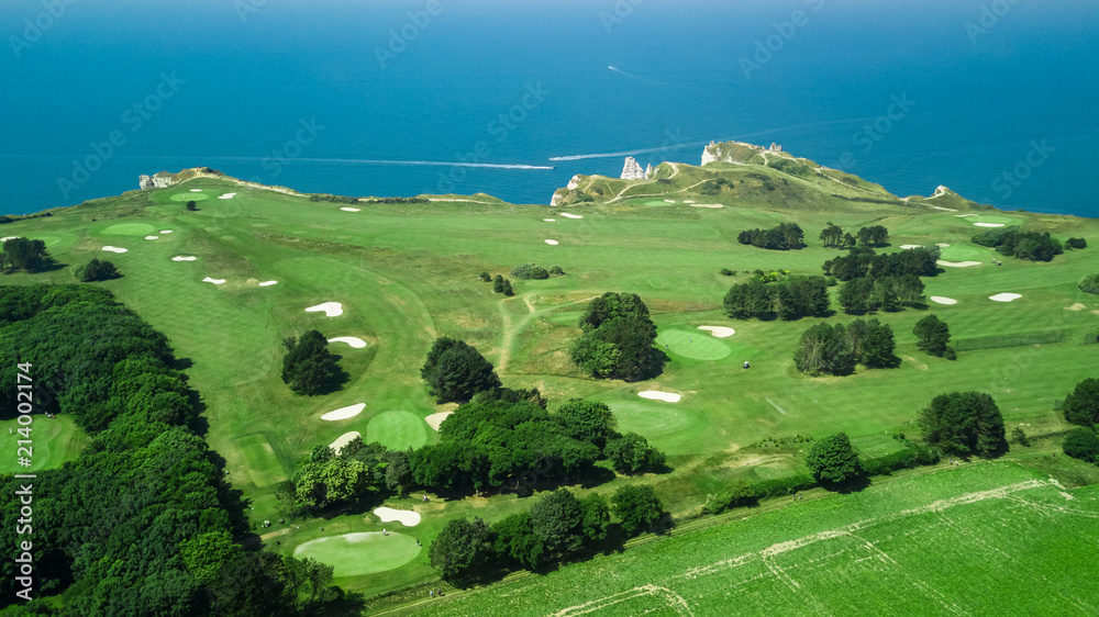 Drone view of a cliff side golf course next to the ocean in Etretat ...