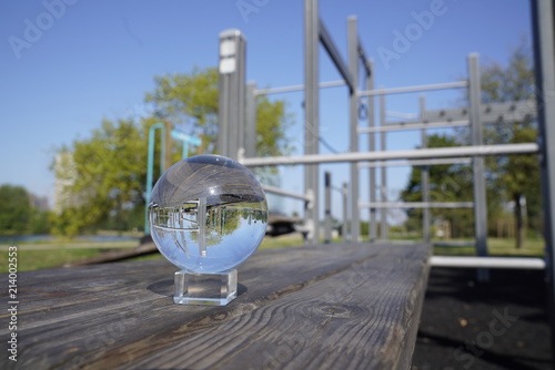 Lensball in front of a street workout machines in a park