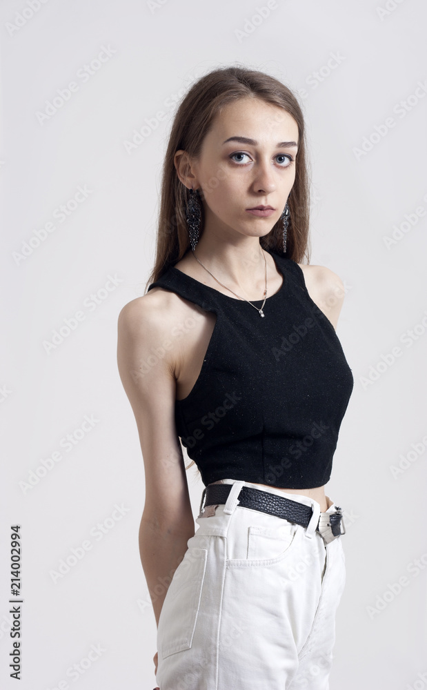 skinny girl posing for the camera Stock 写真 | Adobe Stock