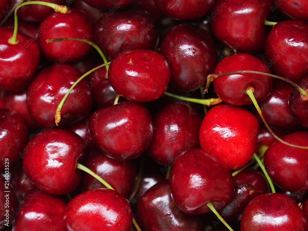 Fresh sweet cherry background, prunus avium. Close-up wild cherry fruit texture Fresh sweet cherry background, prunus avium. Close-up wild cherry fruit texture