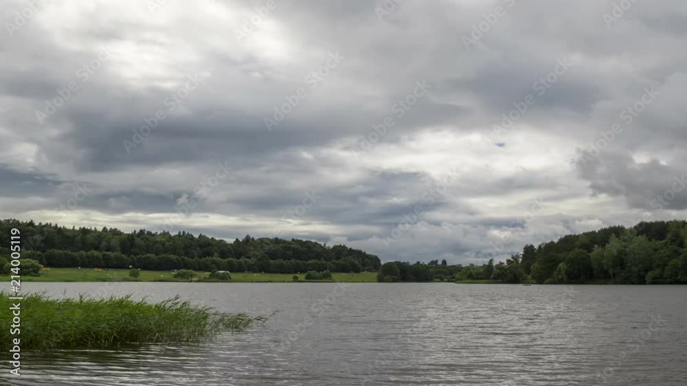 Rain clouds over lake, dramatic sky, time-lapse 4K.
Rain clouds over lake, dramatic sky, time-lapse 4K.
