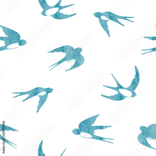 Flying swallows silhouettes. Seamless watercolor pattern.