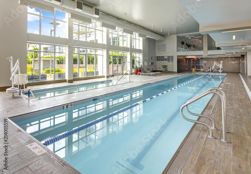 Swimming pool in luxurious apartment building. photo
