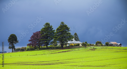 Farmhouse and stormy sky