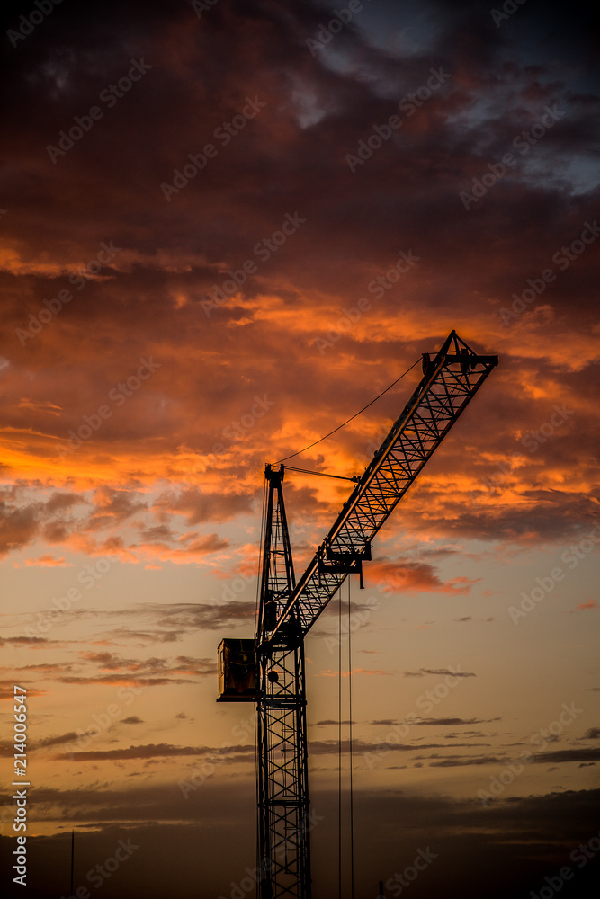 Construction crane.Crane at sunset.Fire sunset