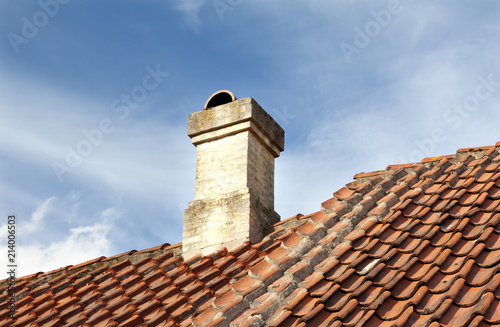 Old town of Odense, Denmark. Tile roof with chimney.