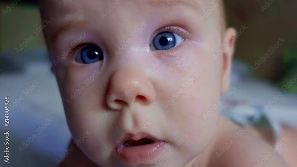Close up portrait of a beautiful little kid with deep blue eyes. Close up portrait of a beautiful little kid with deep blue eyes.