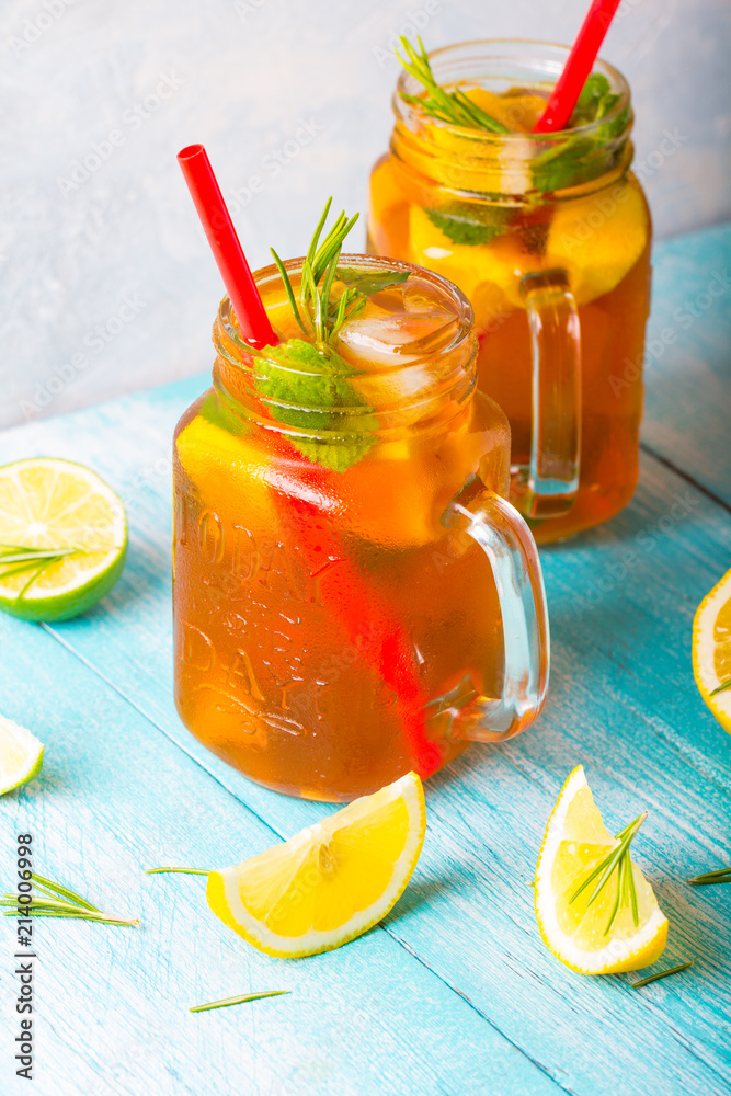 ice tea lemon fresh mint rosemary wooden background
ice tea lemon fresh mint rosemary wooden background