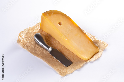 Photography Dutch old Amsterdam cheese, made from cow milk on white background