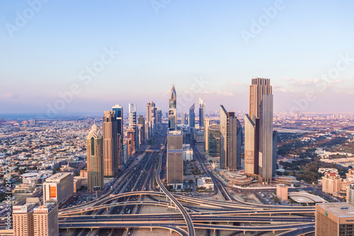 DUBAI, UAE - FEBRUARY 21, 2014. Aerial skyline view on Dubai main street - Sheikh Zayed Road and skyscrapers in evening on sunset