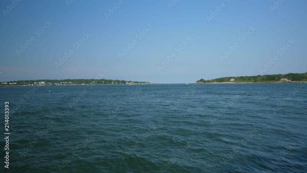 A wide shot view of Portland, Maine's Fore River harbor. Cushing Island and Fort Scammel in the distance. Shot at 48fps. A wide shot view of Portland, Maine's Fore River harbor. Cushing Island and Fort Scammel in the distance. Shot at 48fps.