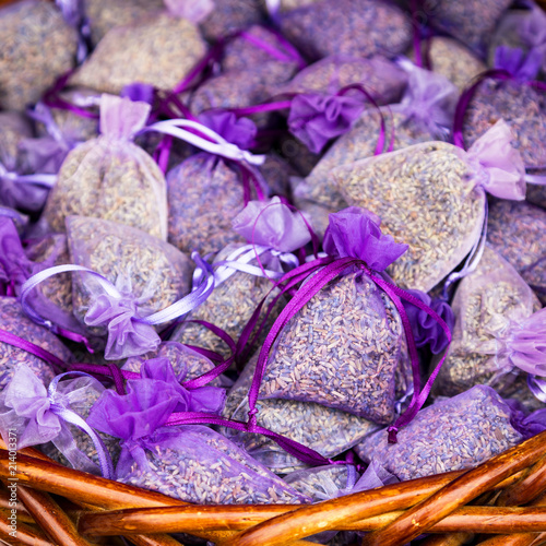 Fototapeta Naklejka Na Ścianę i Meble -  Fresh Dried Lavender Scented Sachets in Small Purple Organza Bags. Selective focus.