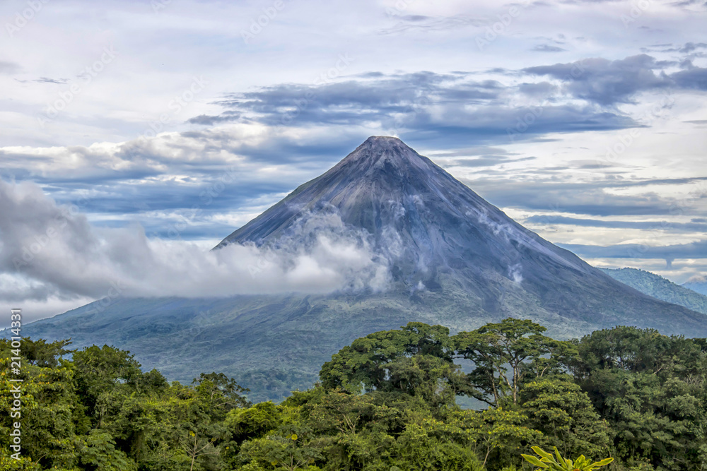 Fototapeta premium Arenal Volcano with Clouds and Jungle