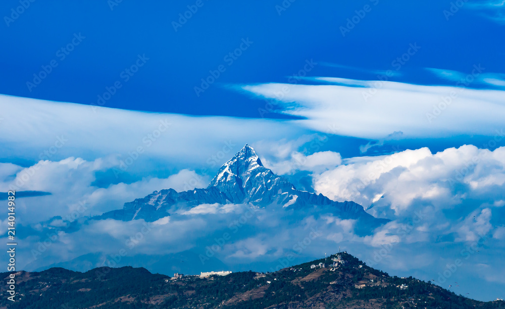 The Himalayas in Nepal shrouded in clouds. 