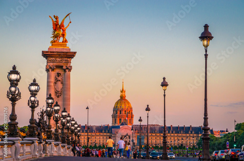 Beautiful sunset view on Pont Alexandre III and Les Invalides in Paris, France