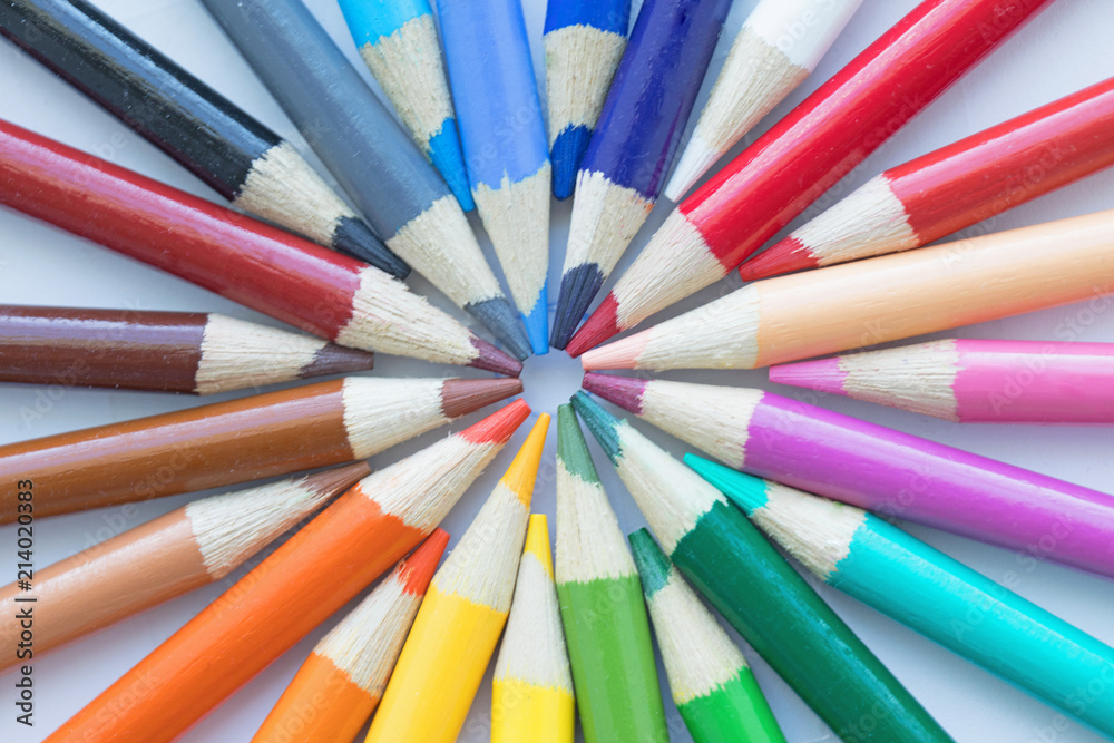 Photograph of a collection of colored pencils arranged in a circular pattern Photograph of a collection of colored pencils arranged in a circular pattern