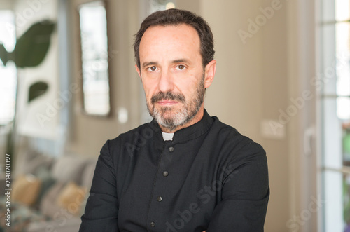 Christian priest man with a confident expression on smart face thinking serious