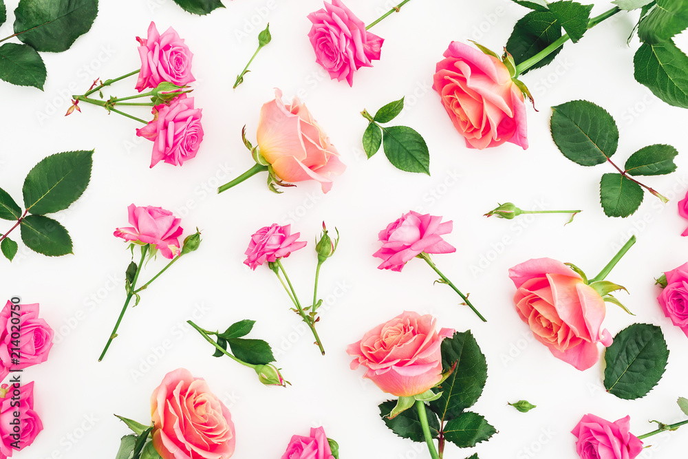 Pattern with roses flowers, petals and leaves on white background. Flat lay, top view.